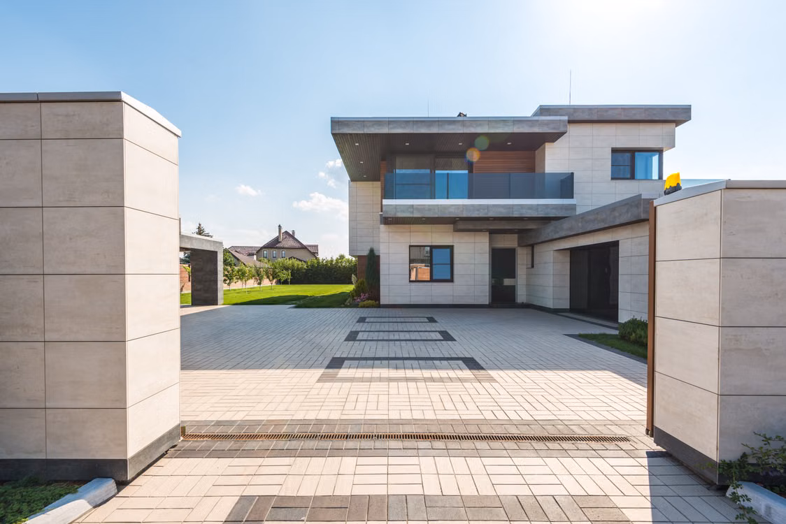 Contemporary two-story residence with a landscaped entrance